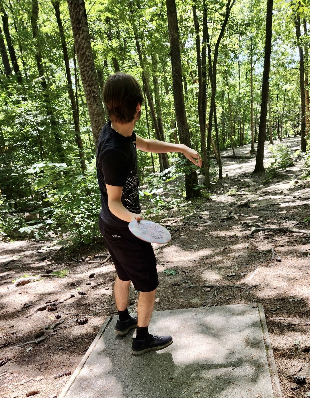 Evan playing disc golf